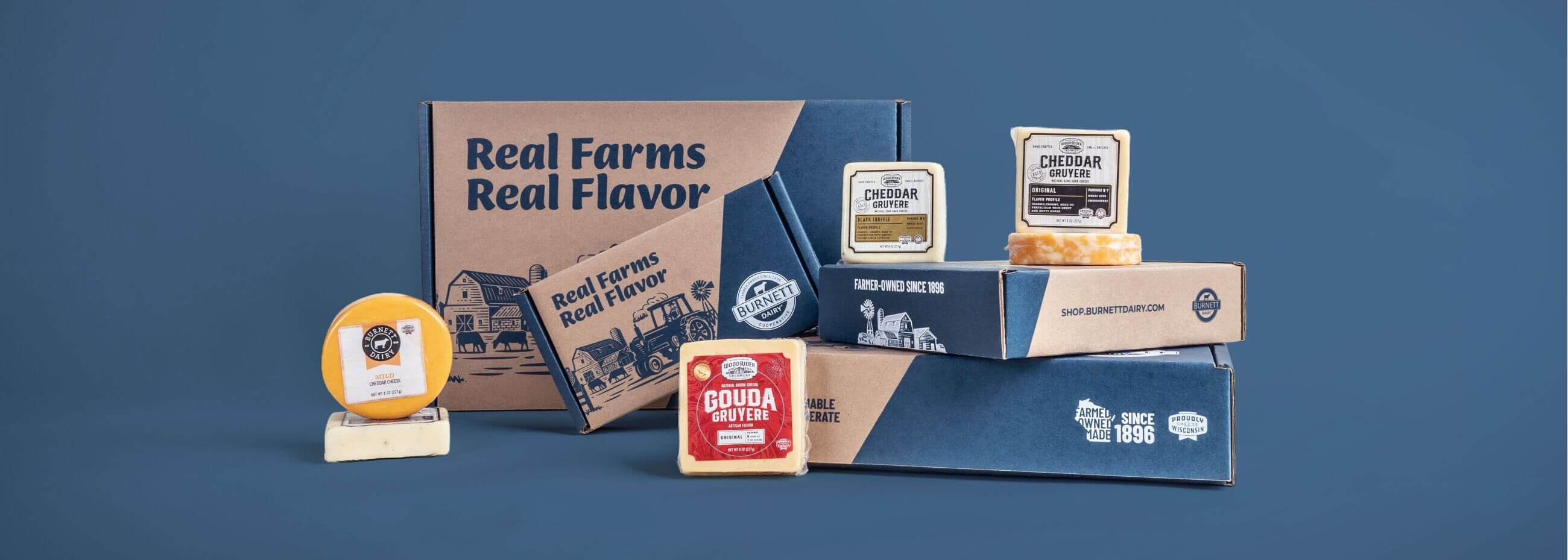 Burnett Dairy gift boxes on a blue background